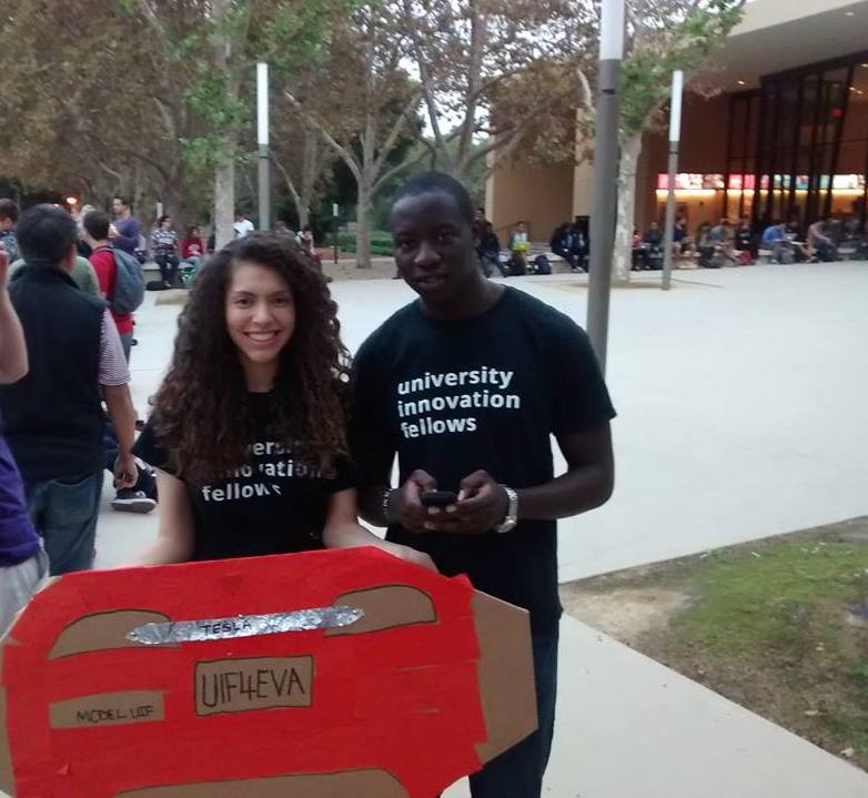 Alexandra Seda (left) & Francis Atore (right) with their DIY Tesla waiting to enter STVP's Future Fest with guest Elon Musk. 