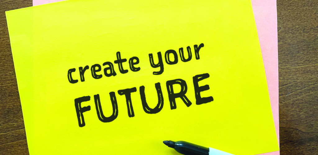 Marker and 'create your future' written on yellow paper